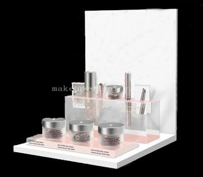 White acrylic display stands for skincare products